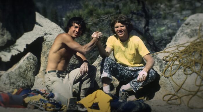 two 1970s climbers celebrating